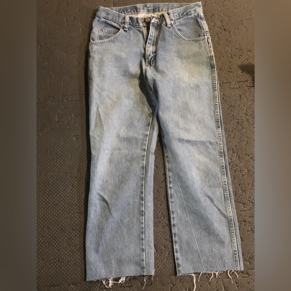 Wrangler jeans with frayed bottoms